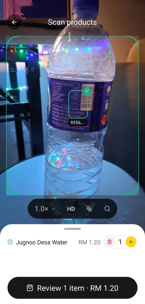 Qwuik scanner recognising a bottle's barcode and adding it to the basket